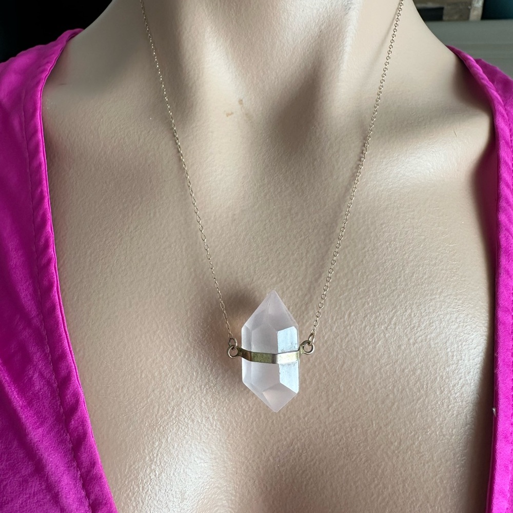 Beautiful light pink crystal necklace. Gold plated chain. Good used condition.